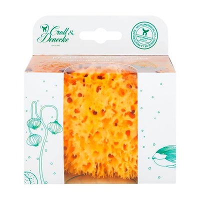 Une éponge naturelle dans une boîte cadeau écologique